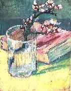 Blossoming Almond Branch in a Glass with a Book
